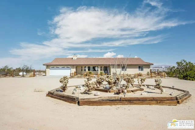 a view of a swimming pool with a seating space
