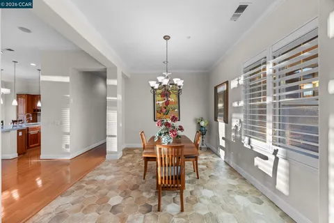 a dining room with furniture and window