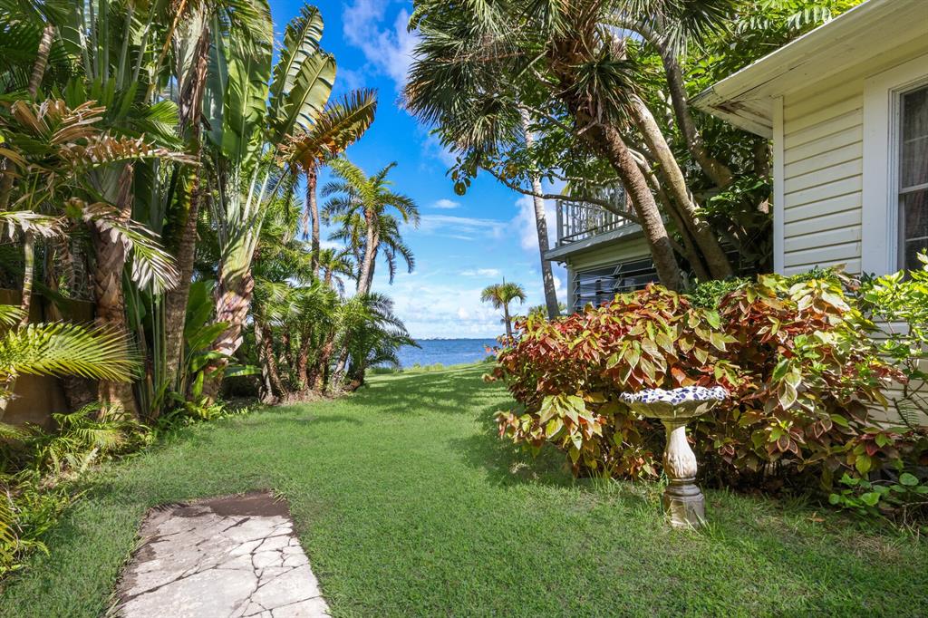 3301 Bay Shore Road Sarasota, FL 34234 - Photo 18 of 51 a backyard of a house with lots of green space