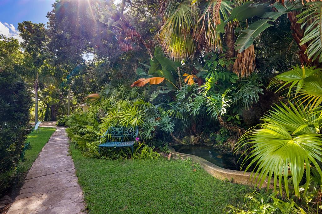 3301 Bay Shore Road Sarasota, FL 34234 - Photo 31 of 51 a view of a yard with a palm tree