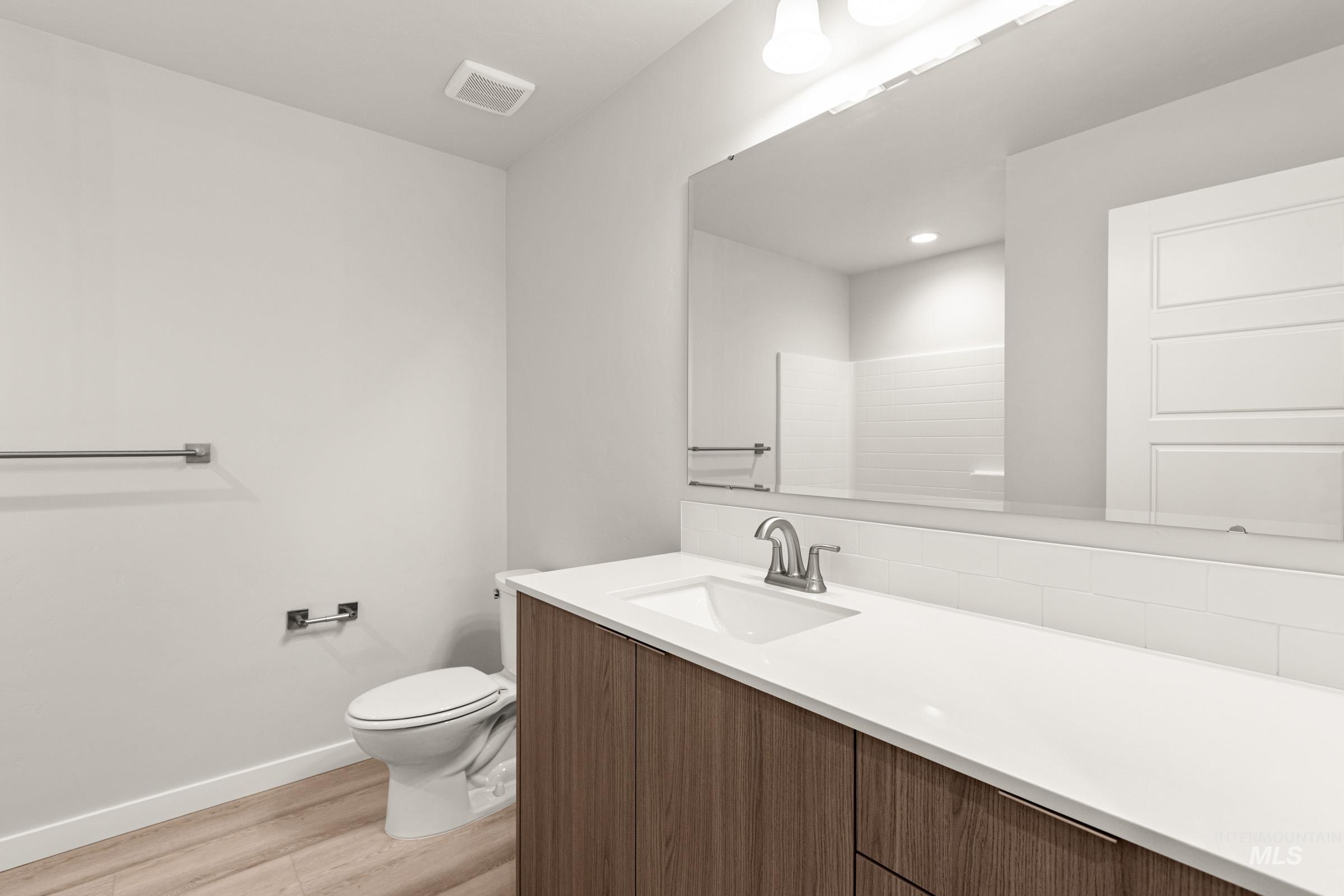 10830 Rutland Street Caldwell, ID 83605 - Photo 13 of 21 Bathroom featuring vanity and light wood-style floors