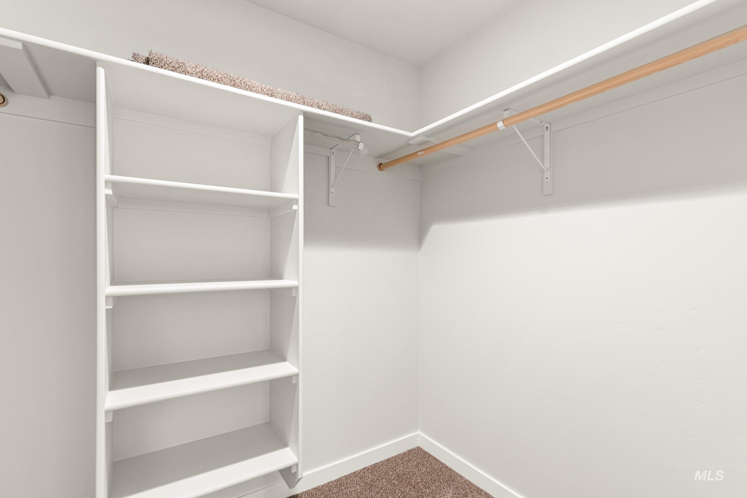 10830 Rutland Street Caldwell, ID 83605 - Photo 17 of 21 Walk in closet with dark colored carpet