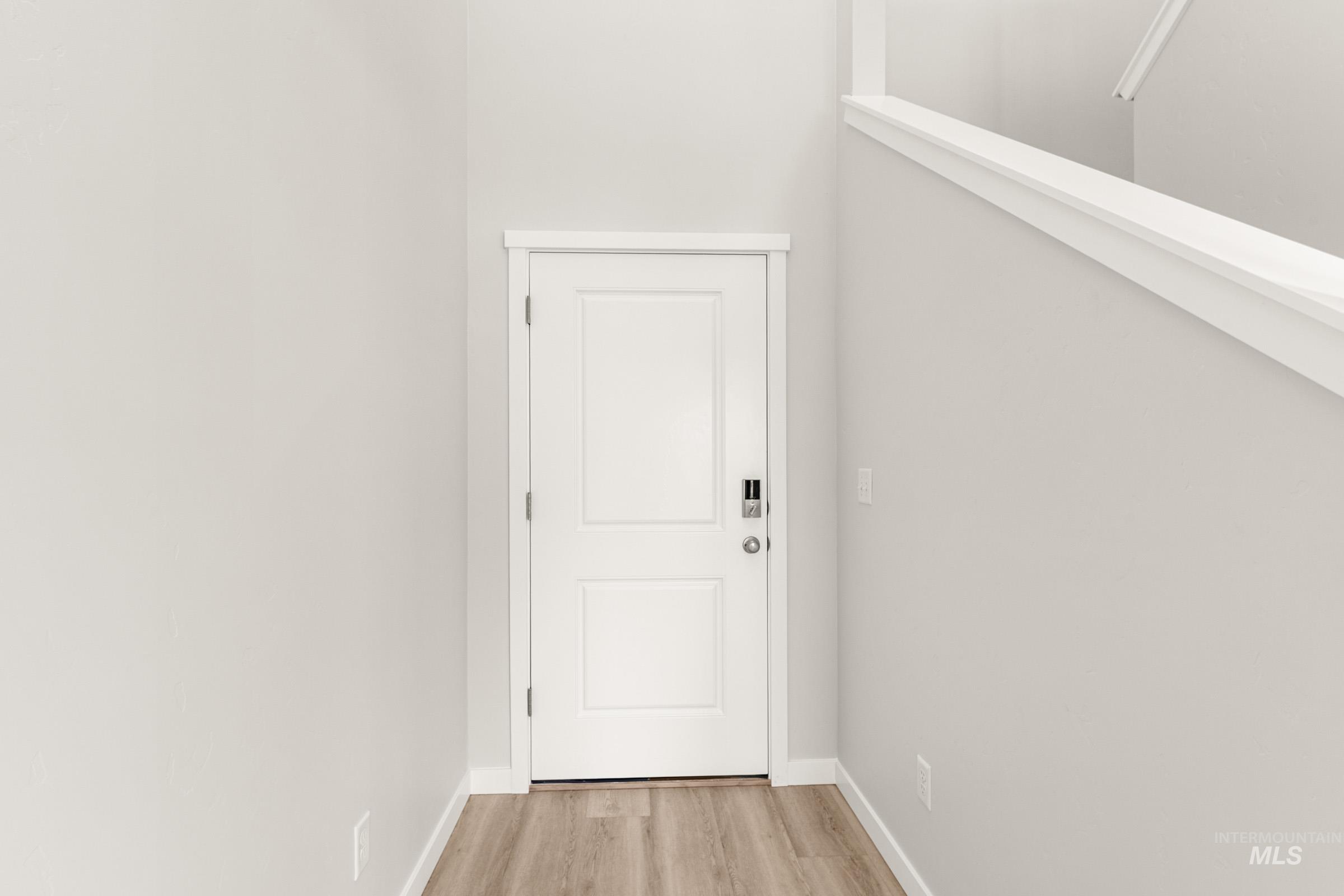 10830 Rutland Street Caldwell, ID 83605 - Photo 2 of 21 Doorway to outside with wood finished floors and baseboards