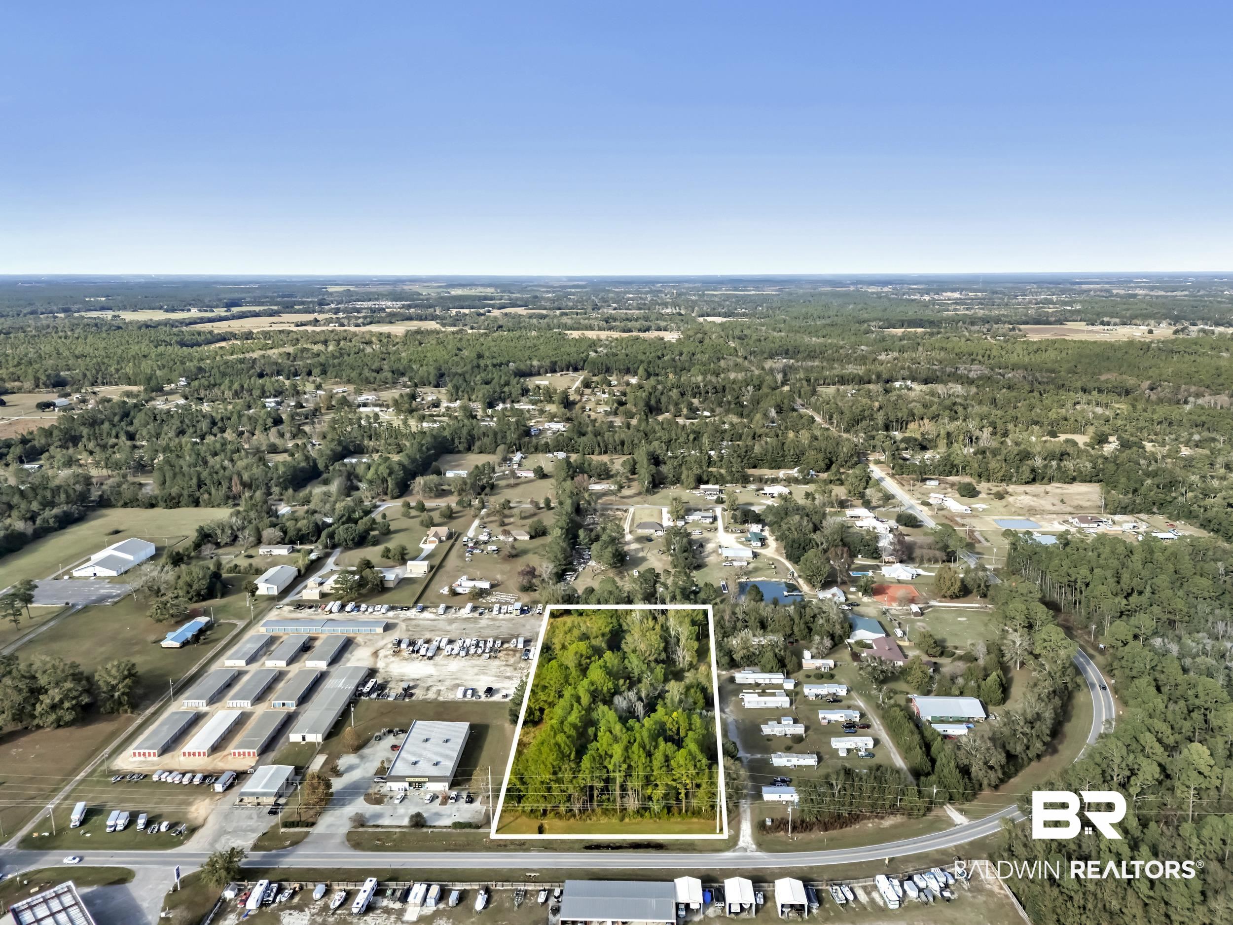 9967 County Road 83 Elberta, AL 36530 - Photo 7 of 21 Aerial view of property and surrounding area featuring property boundaries highlighted and a forest