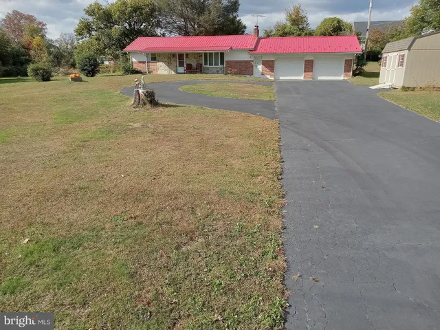 a view of a tree in front of a house