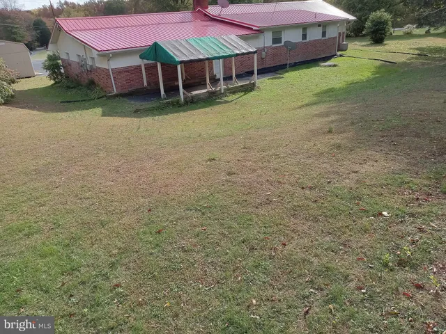 a view of a backyard with a barn