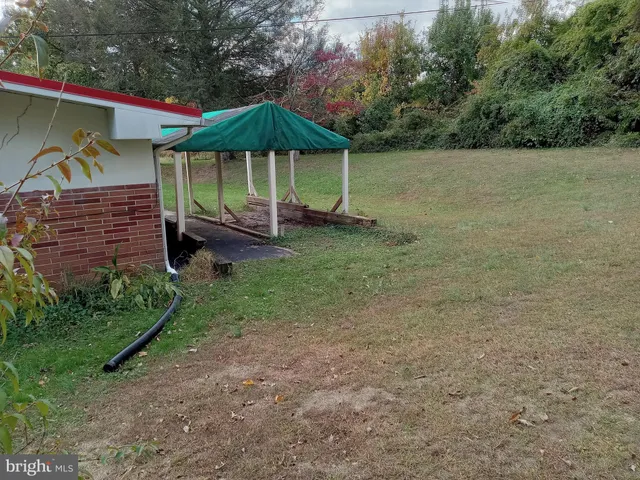 a view of a patio with table and chairs