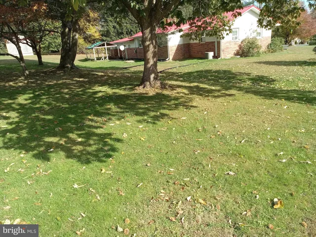 a view of a street with a building in the background