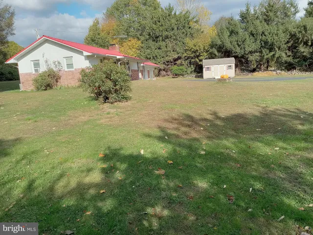 a view of a patio with a yard