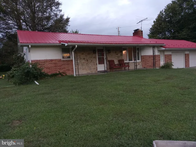 a couple of potted plants in front of door