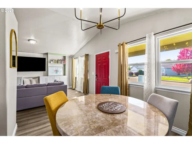 a kitchen with a sink cabinets and wooden floor