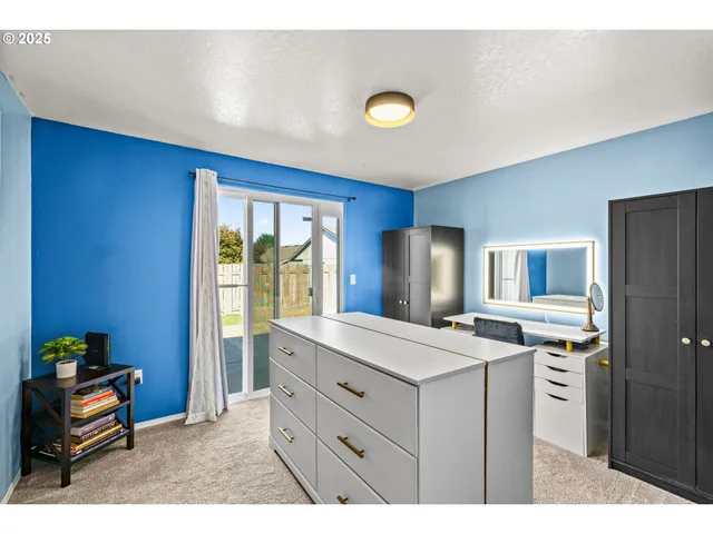 a kitchen with a refrigerator and a sink