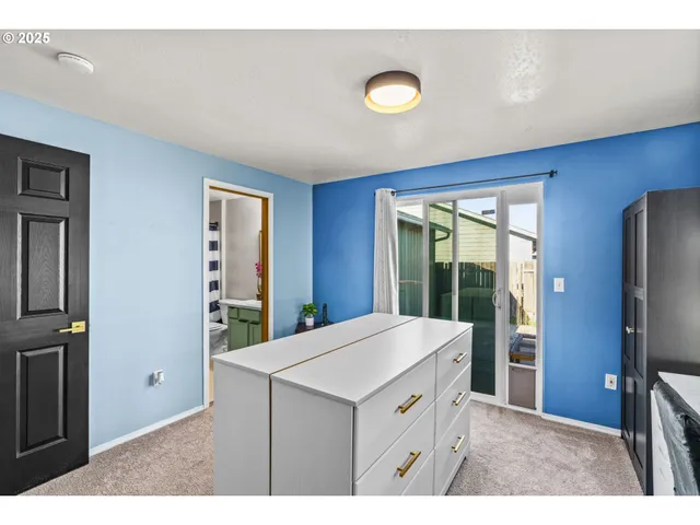 a kitchen view with stainless steel appliances a refrigerator and a stove top oven