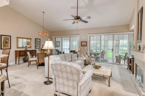 a kitchen with stainless steel appliances granite countertop a sink a stove counter space and cabinets