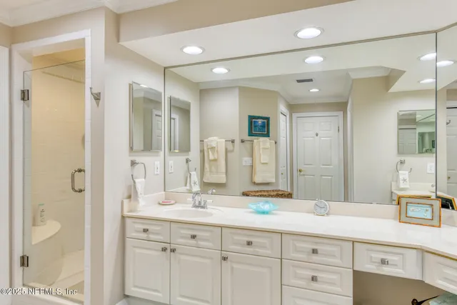 a view of a dining room with furniture a chandelier and window