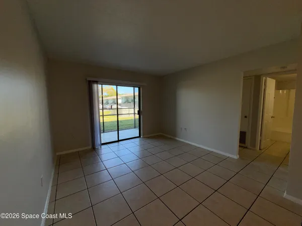a view of an empty room and window