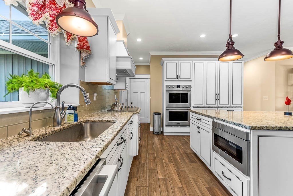 196 Glenwood Road Rutland, MA 01543 - Photo 17 of 37 a kitchen with a stove a sink and a refrigerator