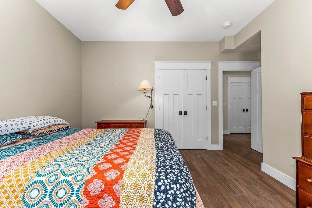 196 Glenwood Road Rutland, MA 01543 - Photo 28 of 37 a bedroom with a bed and wooden floor