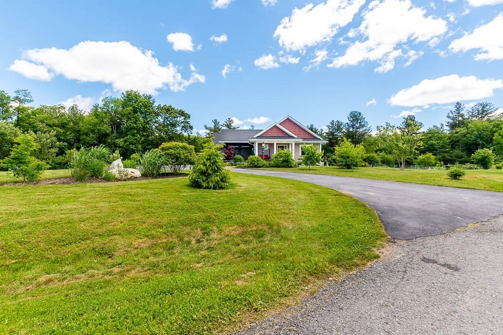 196 Glenwood Road Rutland, MA 01543 - Photo 3 of 37 a front view of a house with a big yard