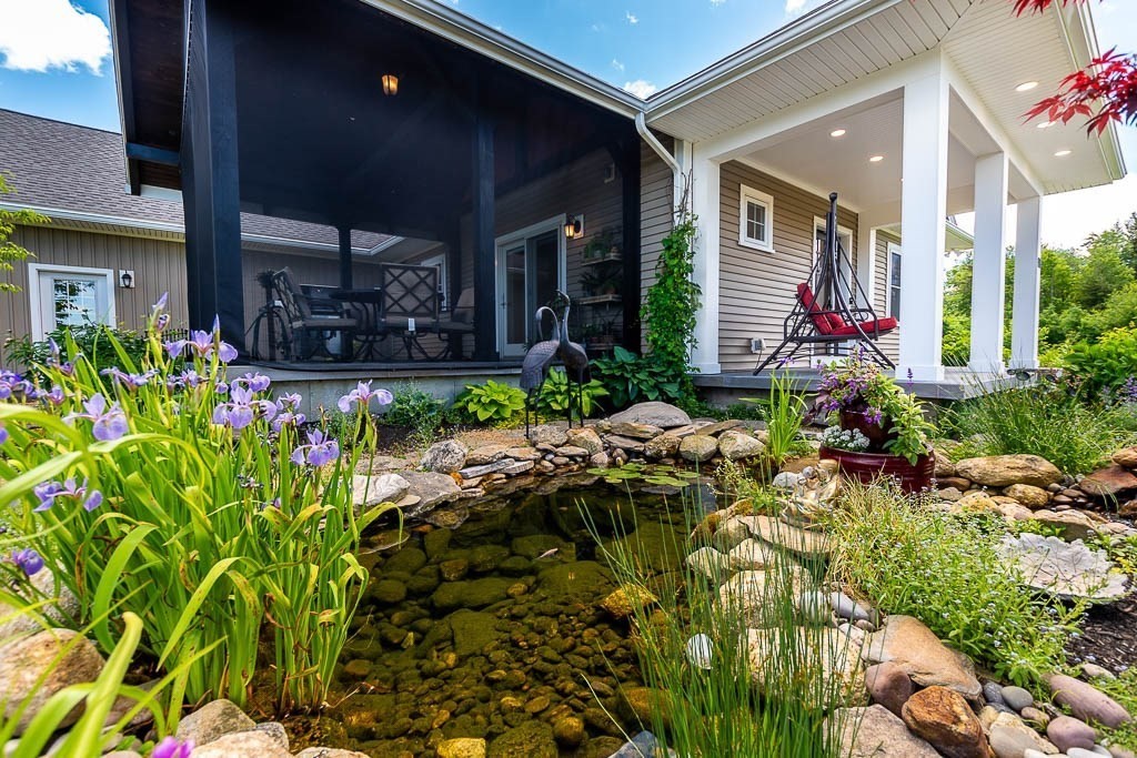 196 Glenwood Road Rutland, MA 01543 - Photo 4 of 37 a bunch of flowers in front of house