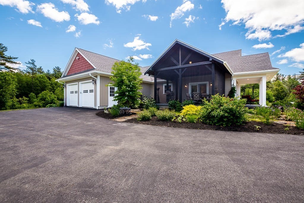 196 Glenwood Road Rutland, MA 01543 - Photo 5 of 37 a front view of house with yard and trees around