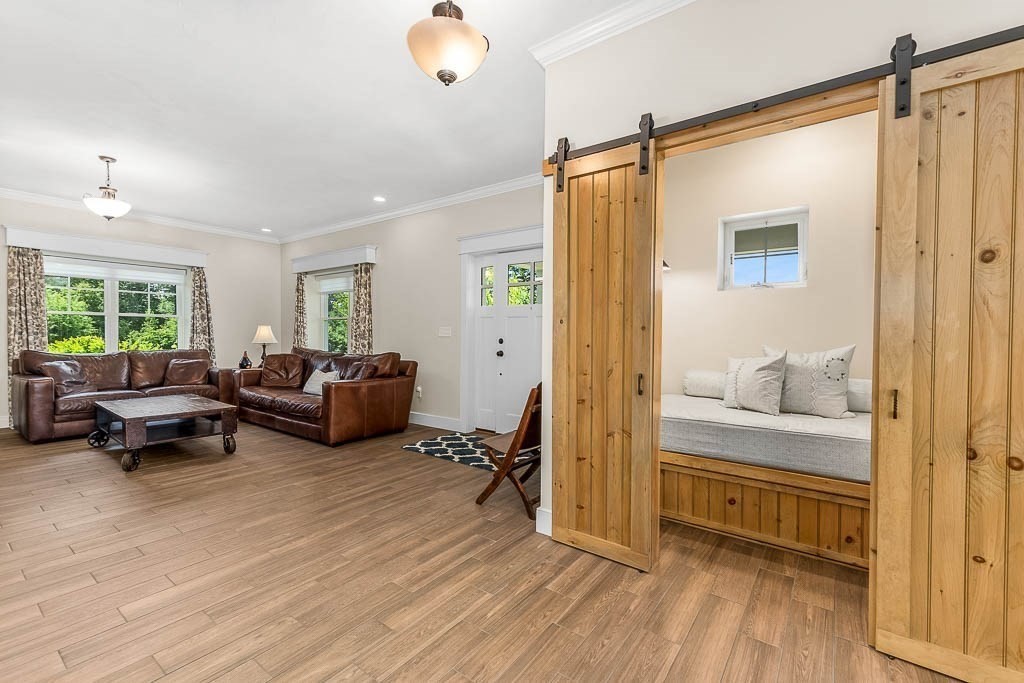 196 Glenwood Road Rutland, MA 01543 - Photo 7 of 37 a bedroom with furniture and a wooden floor