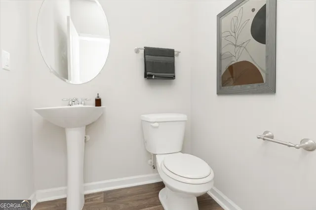 a bedroom with a bed mirror and a window