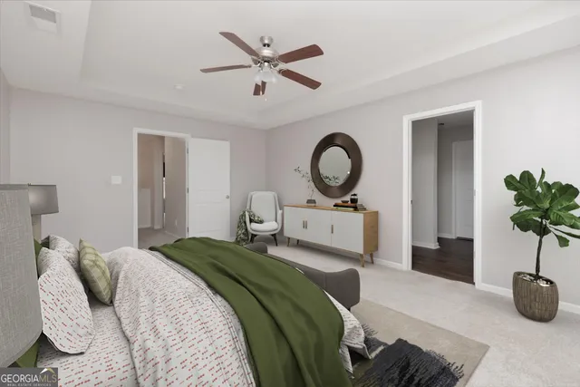 a bedroom with a bed a mirror and a window