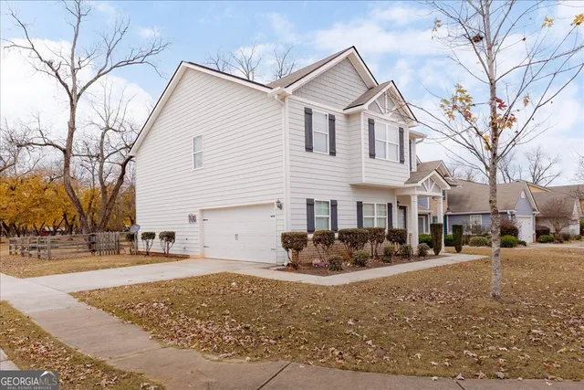 a view of kitchen with wooden floor electronic appliances and window