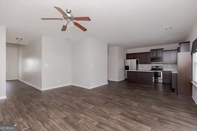 a kitchen with stainless steel appliances granite countertop a refrigerator stove a sink and dishwasher