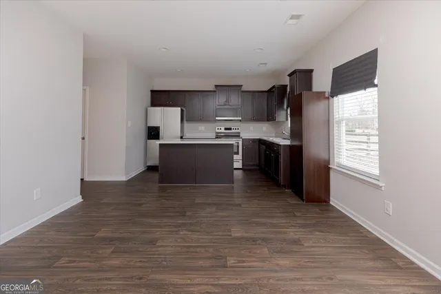 a bathroom with a sink toilet and a mirror