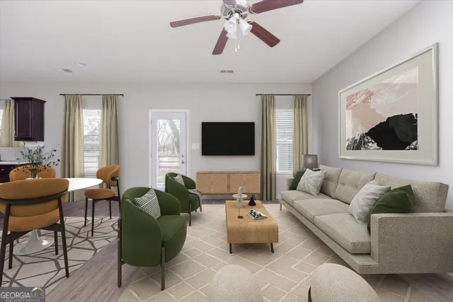 a living room with furniture and a flat screen tv