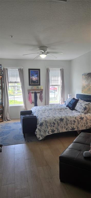 8180 Boat Hook Loop, Unit 108/301 Windermere, FL 34786 - Photo 13 of 27 a bedroom with a bed and a couch