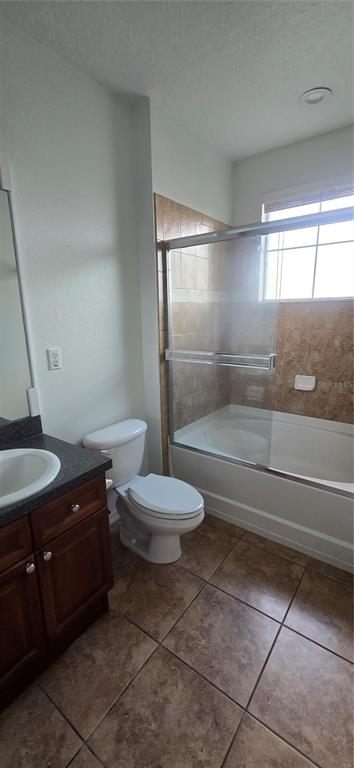 8180 Boat Hook Loop, Unit 108/301 Windermere, FL 34786 - Photo 14 of 27 a bathroom with a granite countertop sink a toilet a vanity and shower