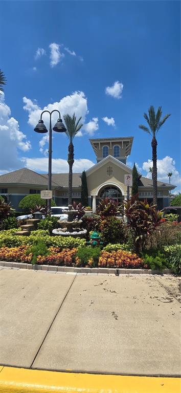 8180 Boat Hook Loop, Unit 108/301 Windermere, FL 34786 - Photo 20 of 27 a front view of a house with a yard