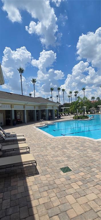 8180 Boat Hook Loop, Unit 108/301 Windermere, FL 34786 - Photo 22 of 27 a view of a lake with a big yard