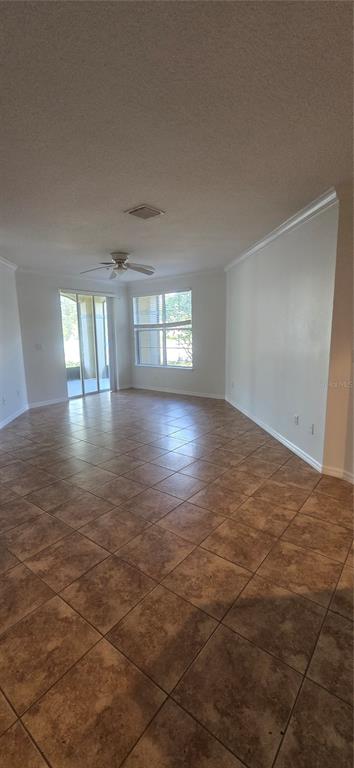 8180 Boat Hook Loop, Unit 108/301 Windermere, FL 34786 - Photo 8 of 27 an empty room with wooden floor and windows