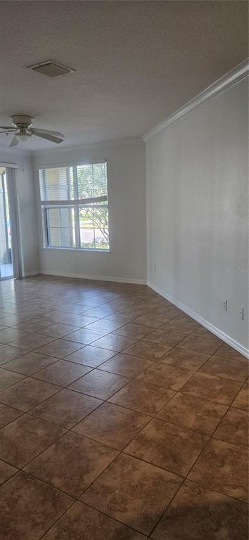 8180 Boat Hook Loop, Unit 108/301 Windermere, FL 34786 - Photo 9 of 27 an empty room with wooden floor and windows