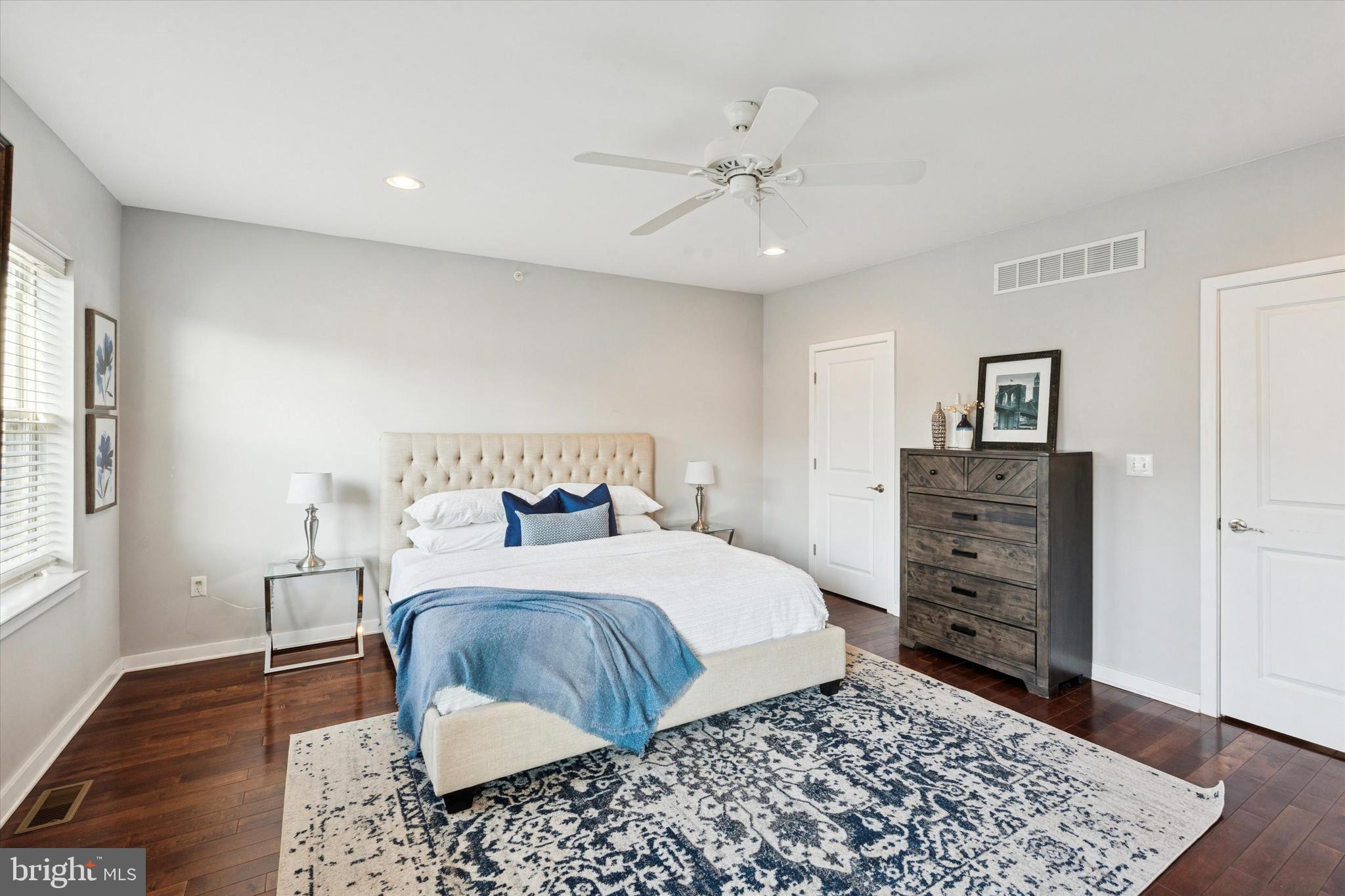 1305 South 2nd Street Philadelphia, PA 19147 - Photo 13 of 30 a bedroom with a bed and wooden floor