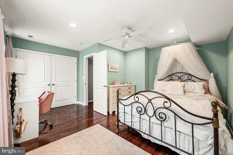 a view of a bedroom with furniture and window