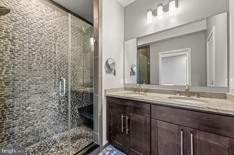 a view of a workspace with furniture and a flat screen tv