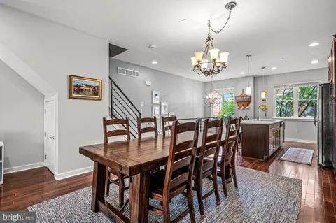 a very nice looking dining room with a table and chairs