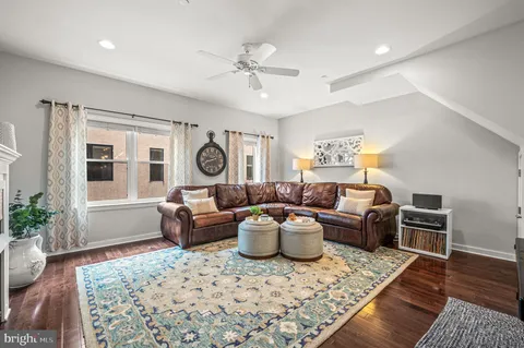 a view of a dining room with furniture wooden floor and chandelier