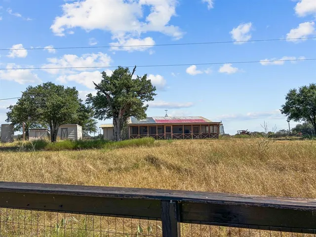 a view of dirt yard with mountain view