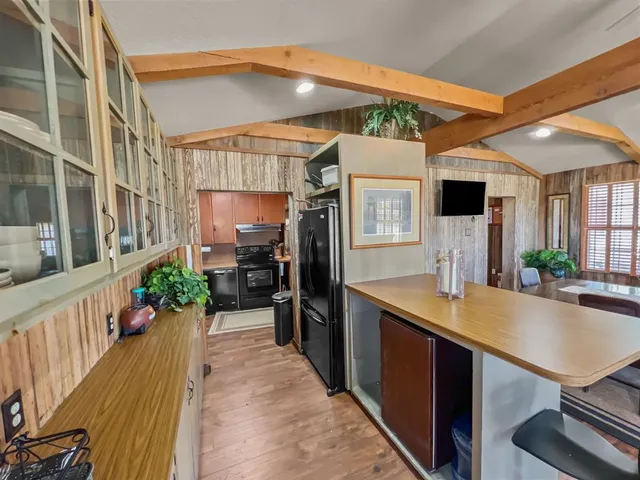 a living room with lots of furniture and clutter