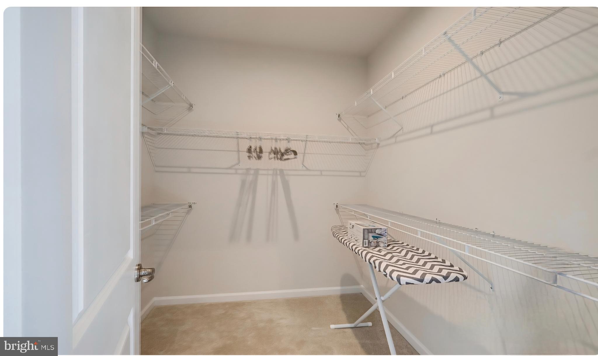 14489 Dolce Lane Woodbridge, VA 22193 - Photo 13 of 26 a view of a room with racks on the wall