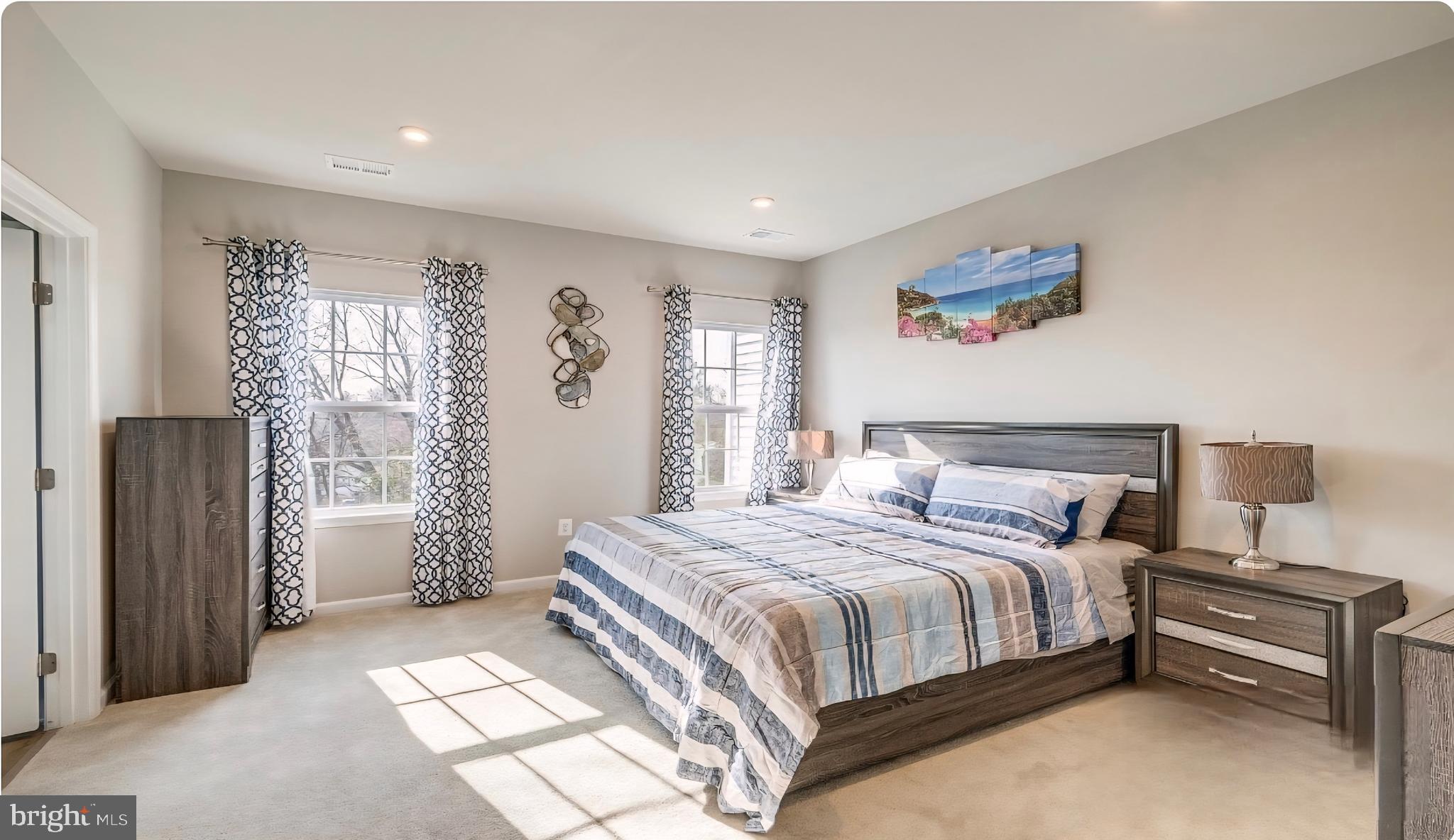 14489 Dolce Lane Woodbridge, VA 22193 - Photo 18 of 26 a bedroom with a bed and a table