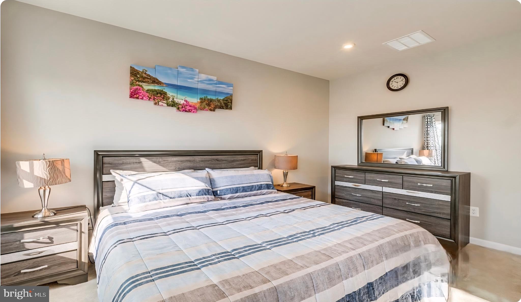 14489 Dolce Lane Woodbridge, VA 22193 - Photo 21 of 26 a bedroom with a bed and a painting on the wall