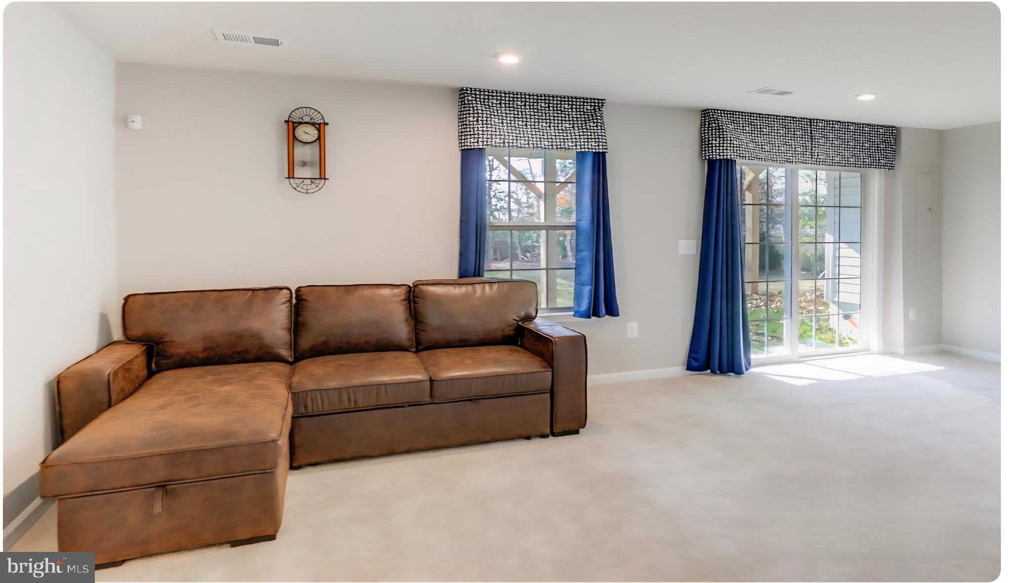 14489 Dolce Lane Woodbridge, VA 22193 - Photo 24 of 26 a living room with furniture and windows