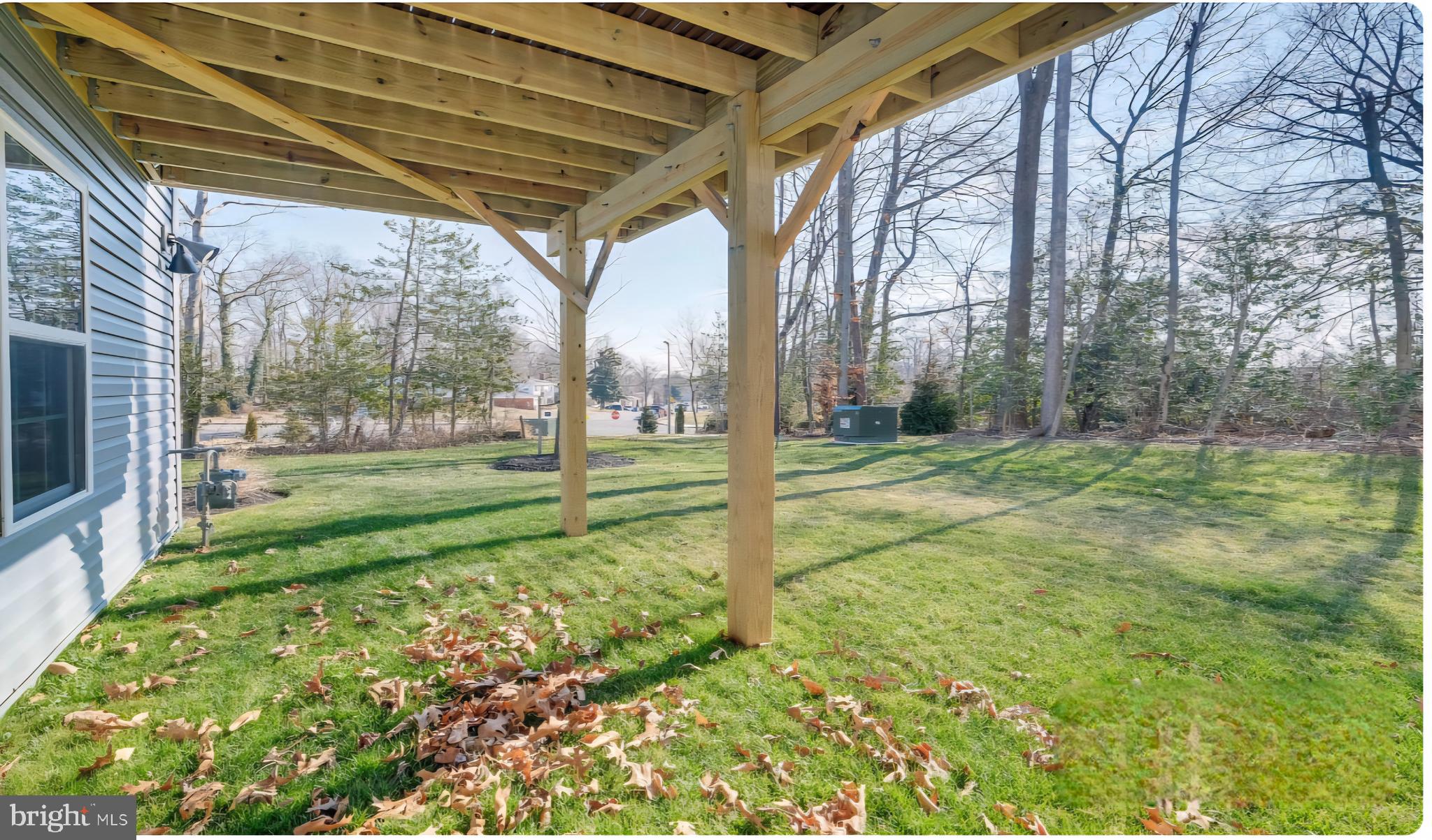 14489 Dolce Lane Woodbridge, VA 22193 - Photo 26 of 26 a view of a house with backyard and trees